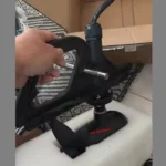 Close up hand held assembly demonstration of Yak Outdoors kayak electric trolling motor adjustable mounting bracket hardware detail
