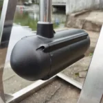 Closeup of 12V brushless outboard trolling motor control head installed on a boat by the water