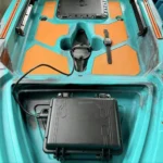 450W brushless kayak motor installed in teal fishing kayak with external battery pack