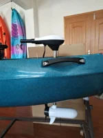 12V electric trolling motor mounted on blue fishing kayak for freshwater angling