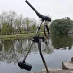 Side view of P300 outboard trolling motor installed on a fishing boat operating on lake water